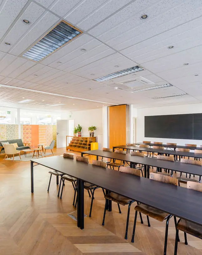 Spacious training room with wooden floor and modern furniture
